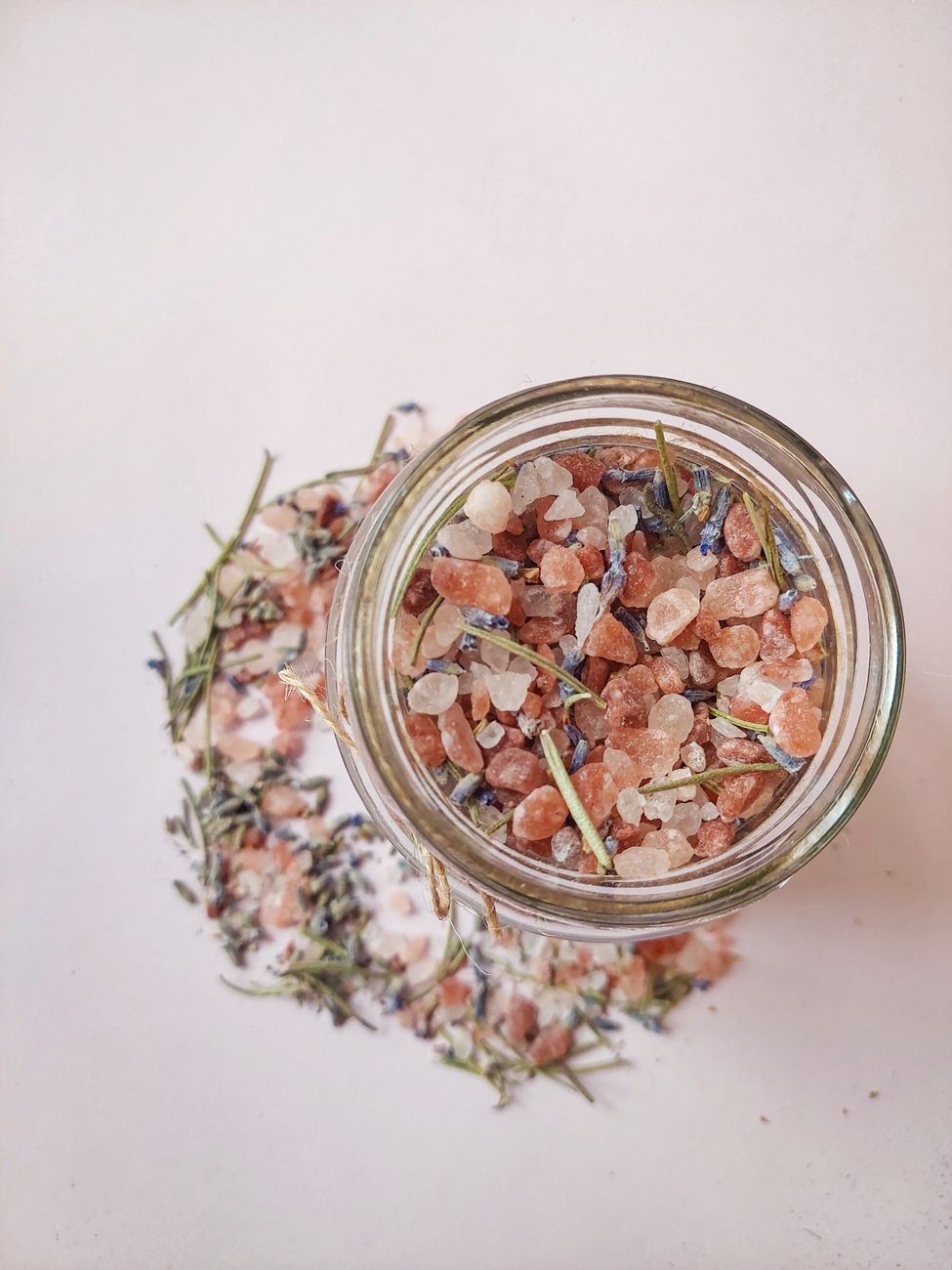 crystals and herbs in glass jar